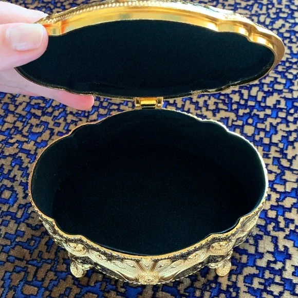 Absolutely stunning jewelry box , golden and black top, made in UAE. Must have!